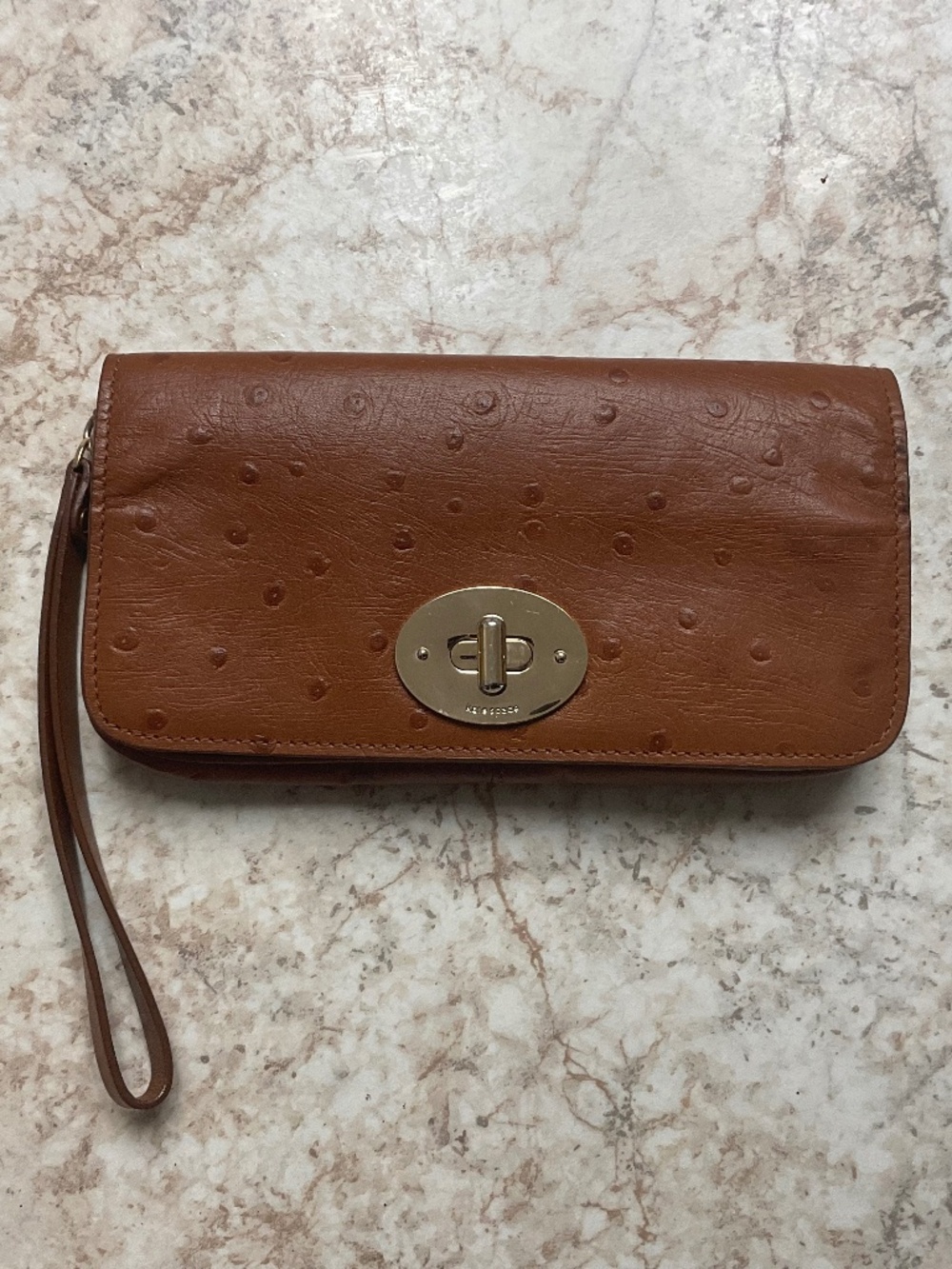 Kate Spade Ostrich-embossed leather  turn lock wrist wallet.